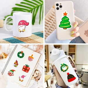 Christmas stickers showing versatile usage on mugs, phone cases, journals and water bottles