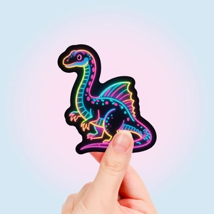 Close-up of a neon-style spinosaurus dinosaur sticker with vibrant colorful outlines