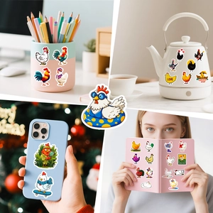 Close-up of funny waterproof chicken stickers on laptop, phone case and bottle