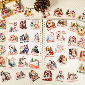 Detail of cute watercolor Christmas dog stickers on a notebook with pine cone accents