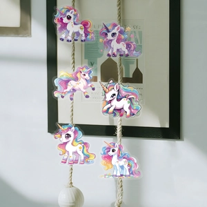Cute dream unicorn PET stickers displayed on a twine rope with a cozy home background