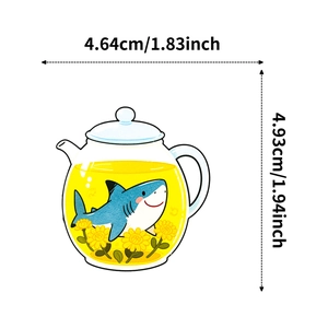 Detail showing cartoon shark in a teapot sticker with 4.93cm height and 4.64cm width