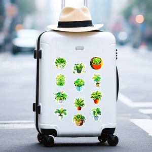 Waterproof green plant stickers applied on a white suitcase for travel decoration