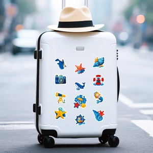 Detailed nautical cartoon stickers on a white suitcase featuring anchor and whale designs
