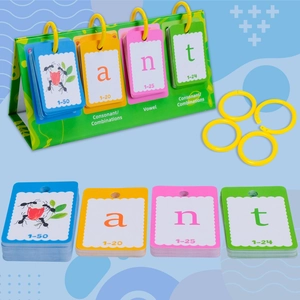 Close-up of spelling cards for kids' English learning showing 'ant' with green desk stand