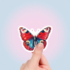 Detailed view of a colorful Y2K butterfly sticker with vibrant red and blue wings