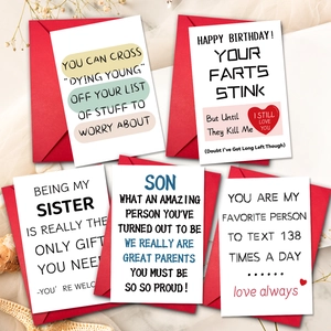 Set of 10 funny English quote greeting cards with red envelopes on a textured desk