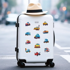 Construction vehicle cartoon stickers shown decorating a white suitcase for kids travel