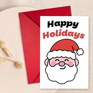 Detailed view of a Christmas card with Santa Claus illustration and a red envelope