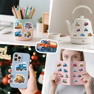 Construction vehicle stickers applied to laptop, water bottle, and phone case surfaces