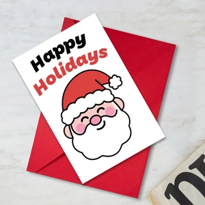 Detailed view of large Christmas greeting card with Santa illustration and red envelope