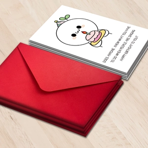 Cartoon birthday card with red envelope set on wood background for gift giving