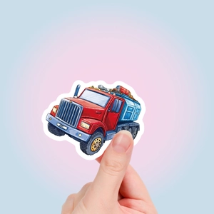 Close-up of hand holding a colorful truck cartoon sticker with white die-cut border