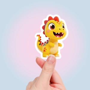 Detail of a cute yellow 3D cartoon dragon sticker held by fingers on gradient background