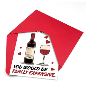Detalle de tarjeta de San Valentín con motivos de vino y sobre rojo a juego