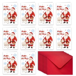 Flat lay of Christmas cards with Santa Claus illustrations and red envelopes