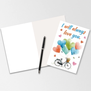 Detail einer Valentinstags-Karte mit Herzballons am Fahrrad und Kugelschreiber auf grauem Grund