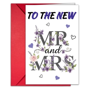 Detailed view of wedding card with floral patterns and a vibrant red envelope