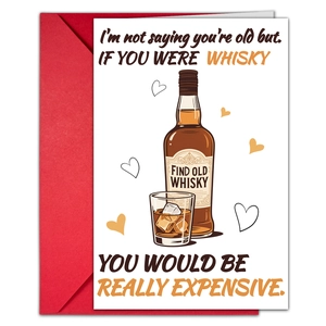 Macro shot of a funny whiskey-themed Valentine card with a vibrant red envelope