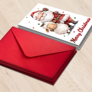 Détail de cartes de Noël avec illustration du Père Noël et enveloppes rouges