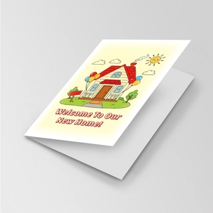 Detailed view of a folded greeting card with a colorful new home cartoon and balloons