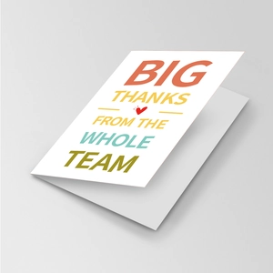 Macro detail of foldable white team appreciation card with Big Thanks lettering