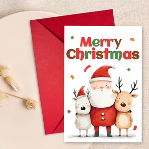 Close-up of a Christmas greeting card with Santa illustration and red envelope