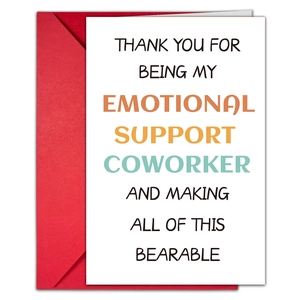 Flat lay of artistic birthday greeting card for colleagues with a vibrant red envelope