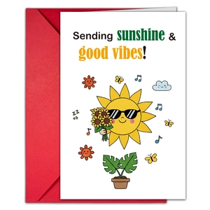 Detail view of a white greeting card with cartoon sun and a vibrant red envelope set