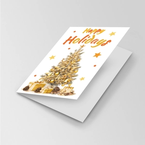 Detail of a folded holiday card with a hand-painted gold Christmas tree and gifts