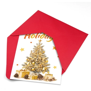 Detail view of white holiday card with gold Christmas tree and bright red envelope