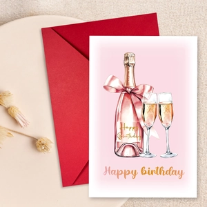 Flat lay of Happy Birthday card with champagne illustration and red envelope