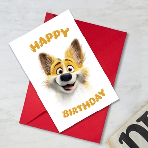 Flat lay of a 3D cartoon dog Happy Birthday card with a bright red envelope on marble