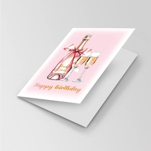 Detail of a large pink watercolor birthday card with champagne glasses and gold text