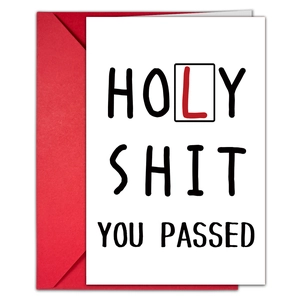 Macro detail of humor driving test card with 'Holy Shit You Passed' text and red envelope
