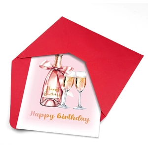 Close-up of birthday card with pink champagne design and a matching red envelope
