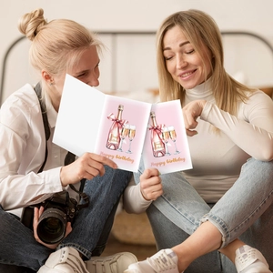 Detail of funny birthday cards with champagne illustrations and Happy Birthday text