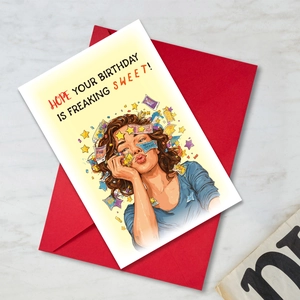 Detail of cartoon birthday card with humorous text on a red envelope background