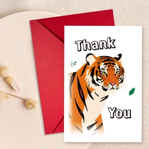 Detail of thank you card set featuring a realistic tiger illustration and a red envelope