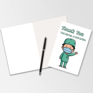Close-up of a thank you card for doctors with cartoon medic illustration and a pen