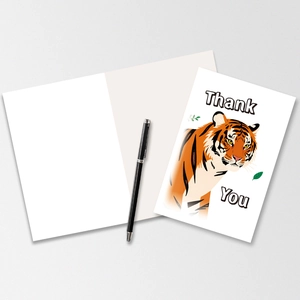Close-up of a thank you card featuring a realistic tiger illustration and pen for scale