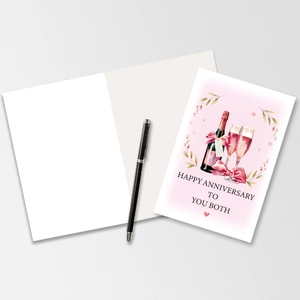 Close-up of anniversary card set with watercolor champagne art and blank interior