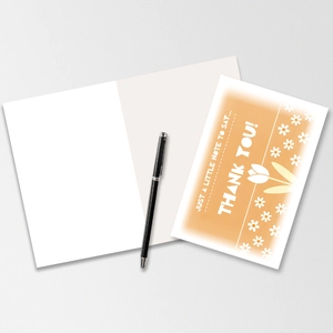 Detail of floral thank you card set with envelope, orange cover and writing pen