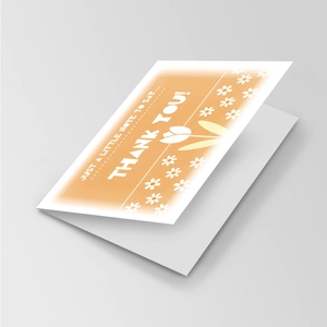 Macro view of floral thank you card featuring white daisies and tulips on orange background