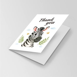 Detail of a folded thank you card with cute cartoon zebra illustration and matching envelope