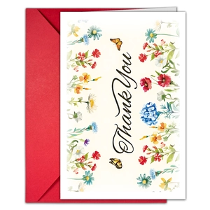 Macro view of floral thank you card with watercolor wildflowers and a vibrant red envelope