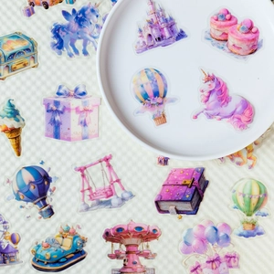 Detail of PET stickers featuring dreamy amusement park motifs on a ceramic plate