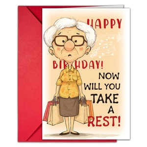 Close-up of a humorous birthday card with cartoon illustration and a red envelope