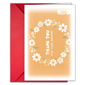 Detailed view of floral thank you card with red envelope and daisy wreath design