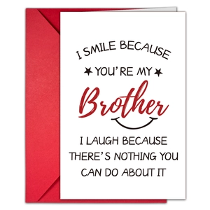 Close-up of a minimalist white birthday card with humor quote and a red envelope set